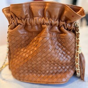 Henri Bendel Tan Woven Leather Bucket Bag with Brown Tassels and Chain Strap
